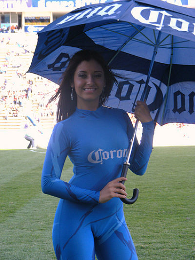 latina corona beer girl - sexy latina model holding an umbrella -wearing a tight corona beer girl outfit